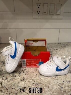 Nike Kids White Sneakers with Blue Swoosh - Size 3C